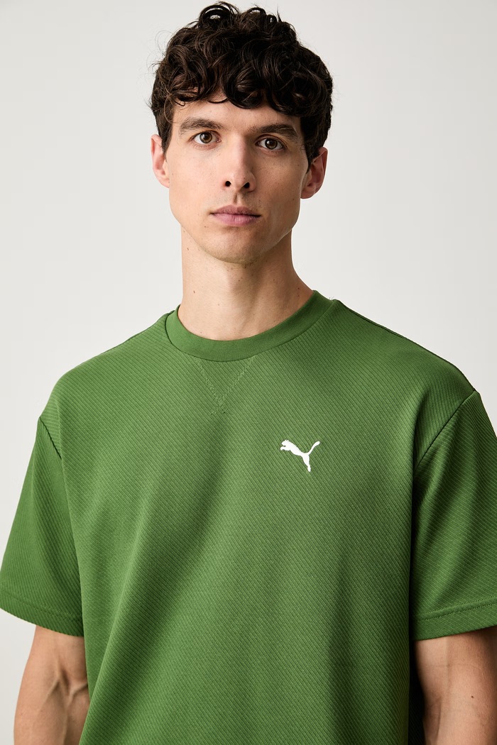 Puma T-shirt męski z bawełną Essentials Elevated zielony 694307
