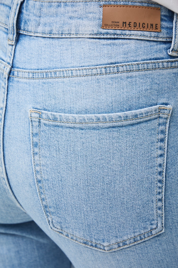 Jeansy flare damskie z efektem sprania niebieski RW26-SJD104