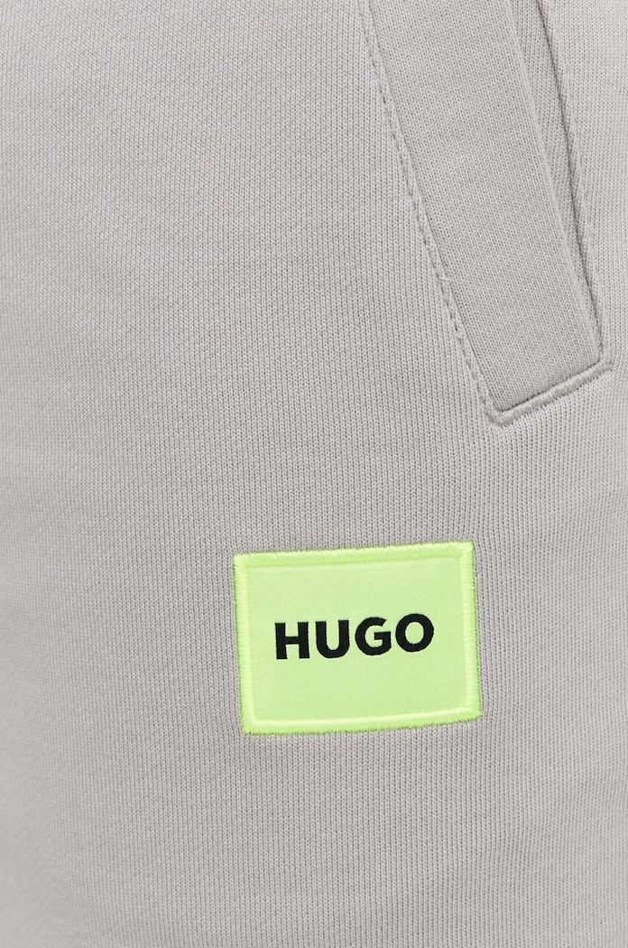 HUGO spodnie dresowe męskie bawełniane Doak212 beżowy 50447963