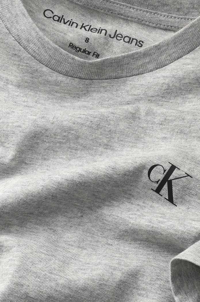 Παιδικό βαμβακερό μπλουζάκι Calvin Klein Jeans γκρί IB0IB01093.PPYY