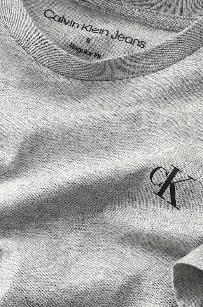 Παιδικό βαμβακερό μπλουζάκι Calvin Klein Jeans γκρί IB0IB01093.PPYY
