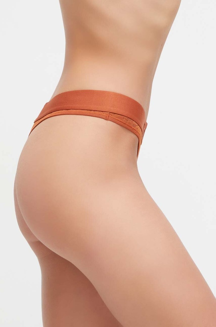 Calvin Klein Underwear stringi 000QF7287E.PPYX pomarańczowy AW23