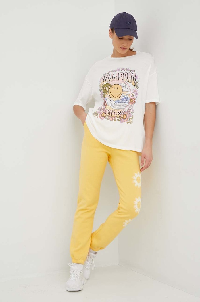 Billabong spodnie dresowe bawełniane X SMILEY ABJNP00343 żółty SS23