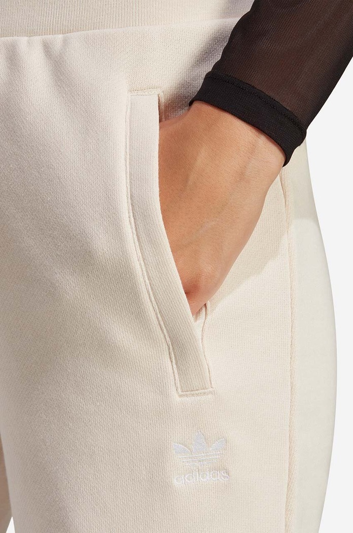 Bavlněné tepláky adidas Originals IA6477 béžová