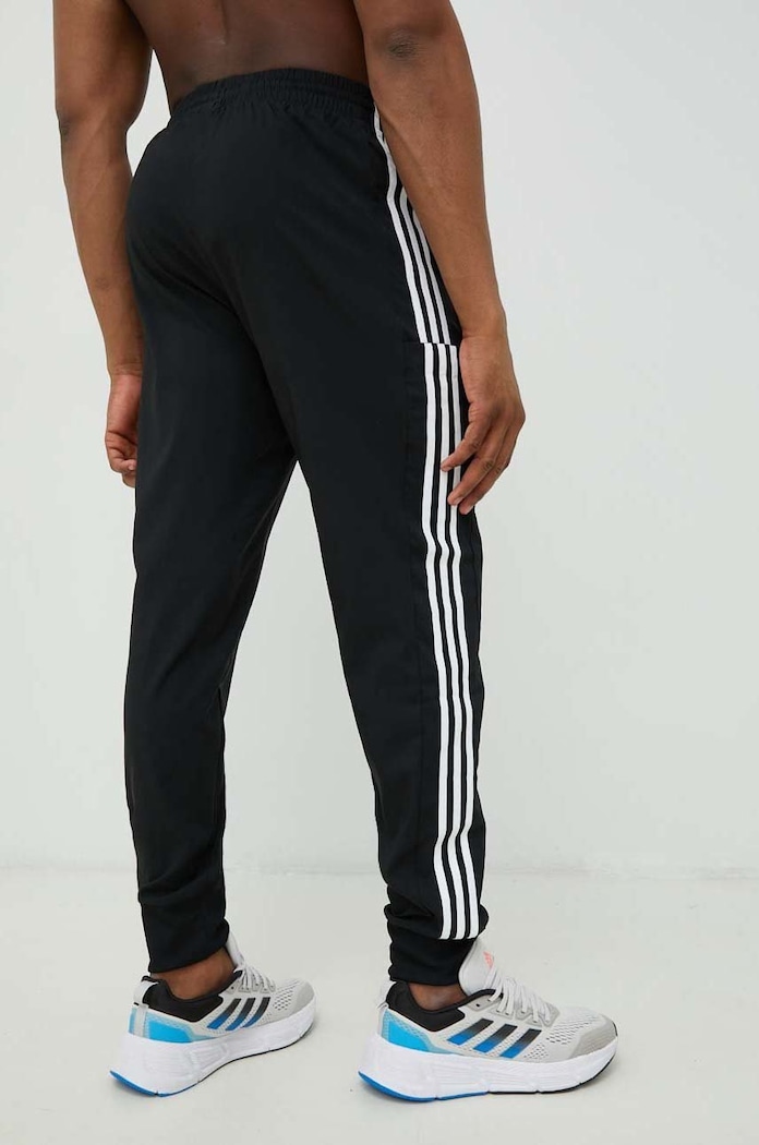 Odzież adidas spodnie treningowe Essentials IC0041 czarny