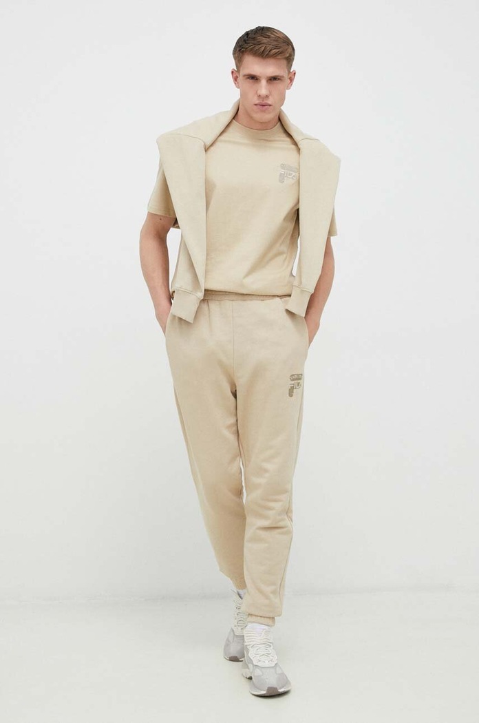 Fila spodnie dresowe bawełniane FAM0338 beżowy SS23