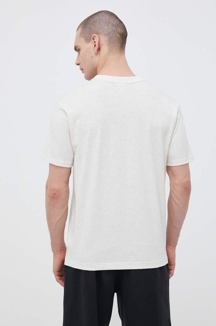 New Balance t-shirt bawełniany beżowy MT31558OTH