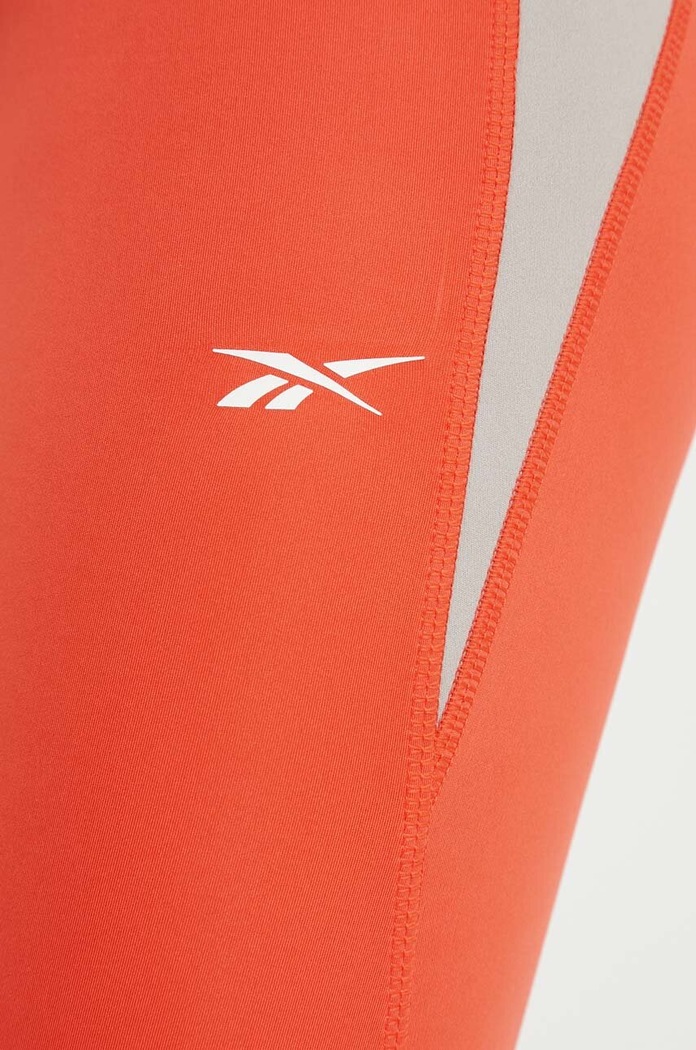 Legginsy do biegania Vector Reebok 100076054 pomarańczowy