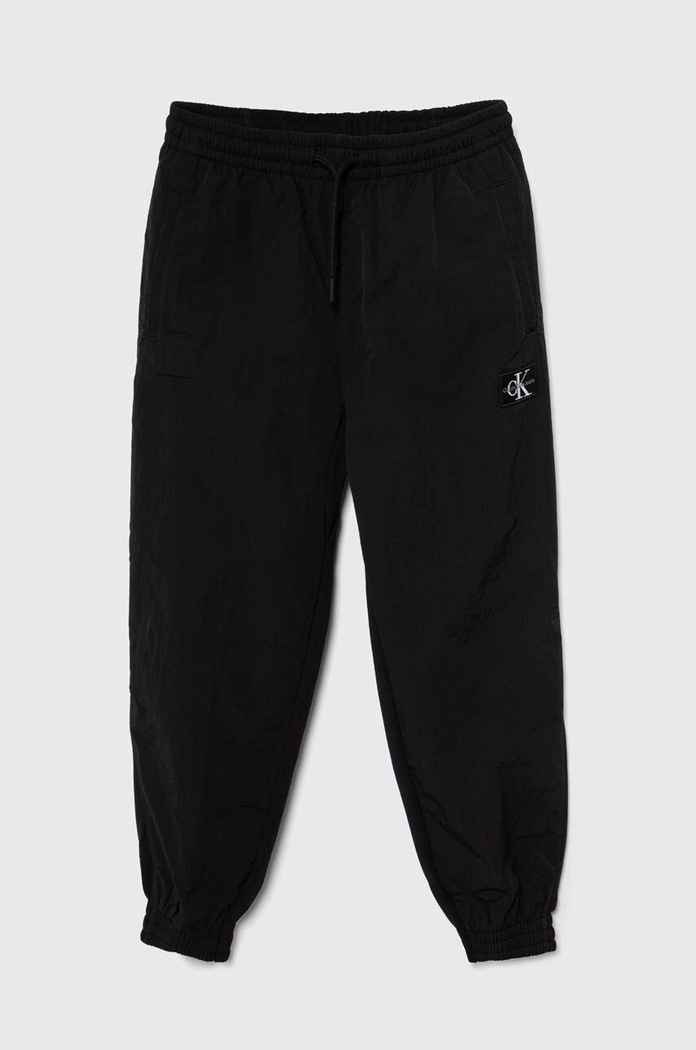 Dětské tepláky Calvin Klein Jeans látka černá IB0IB01934.128.176.PPYH