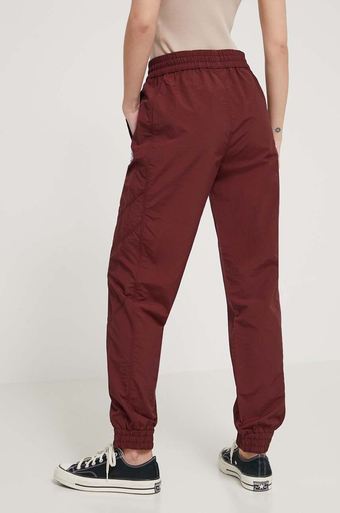 Odzież Converse spodnie dresowe 10026055.A02 bordowy