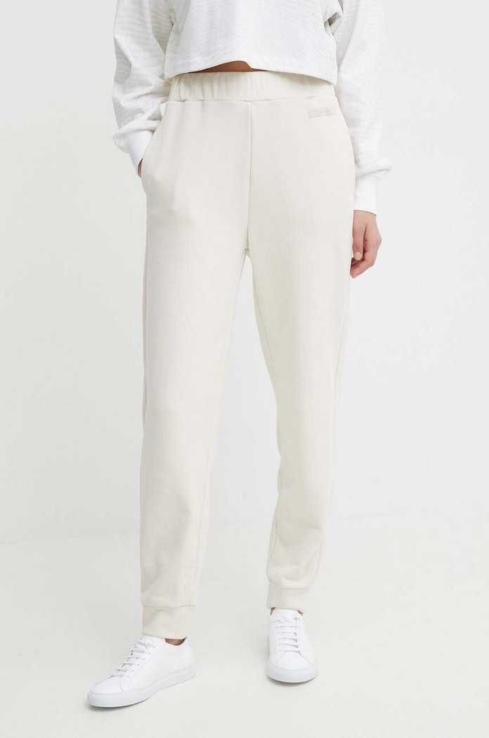 Tepláky Calvin Klein s elastanom béžová K20K206632