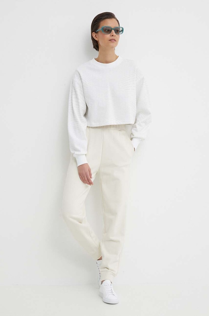 Tepláky Calvin Klein K20K206632 béžová SS24