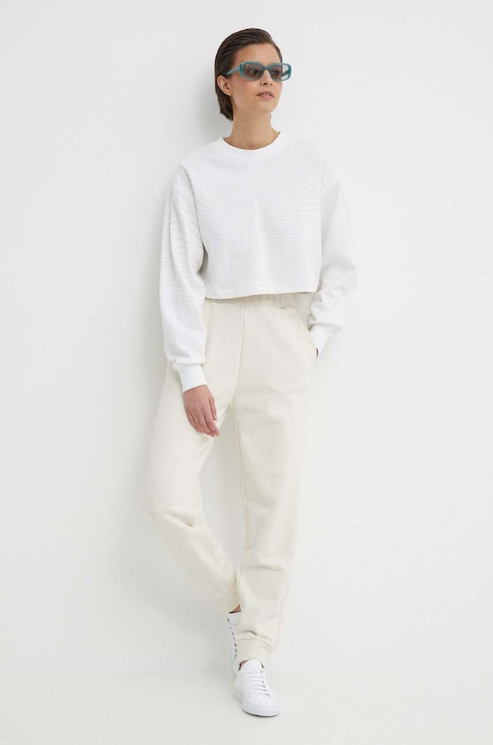 Tepláky Calvin Klein K20K206632 béžová SS24