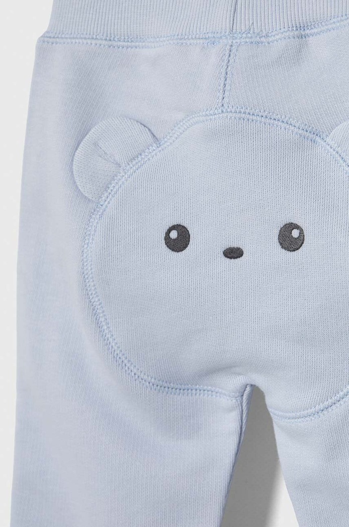 Chłopiec United Colors of Benetton spodnie dresowe bawełniane niemowlęce 3J70AF01L.W.Seasonal niebieski