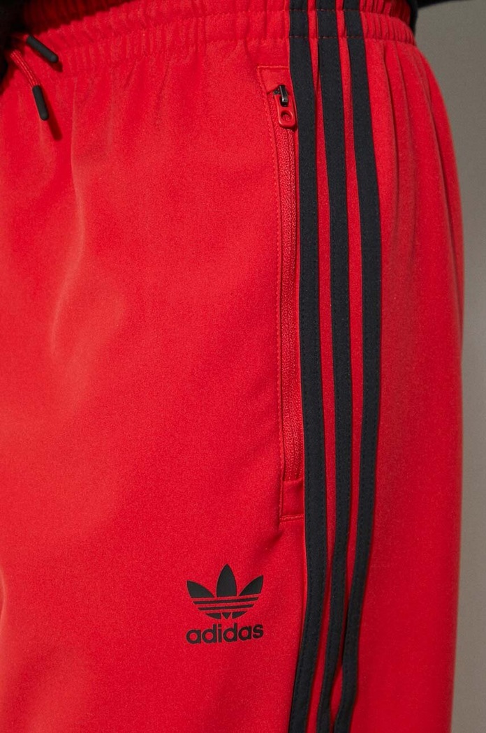 Tepláky adidas Originals IS2808 červená