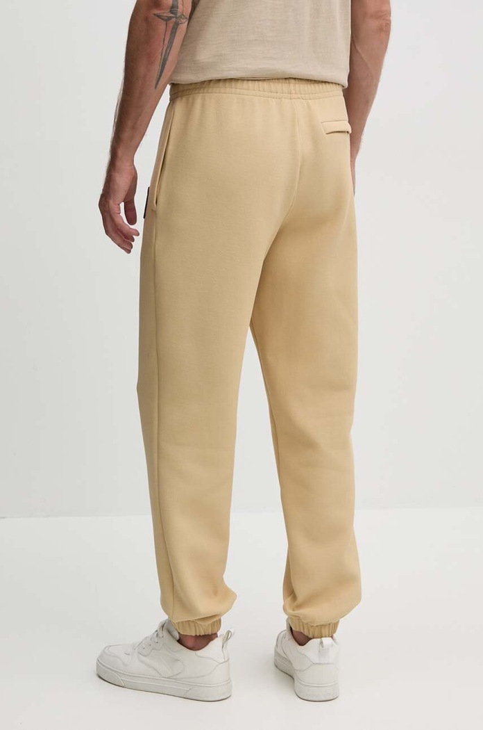 Îmbrăcăminte Lacoste pantaloni de trening XH7441 bej