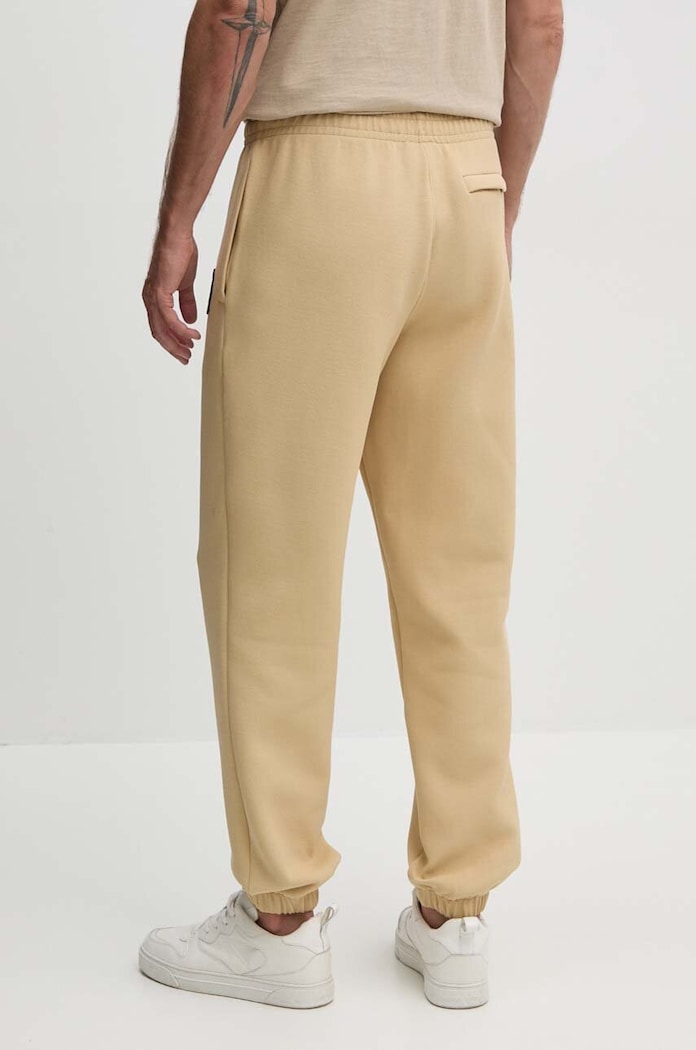 Îmbrăcăminte Lacoste pantaloni de trening XH7441 bej