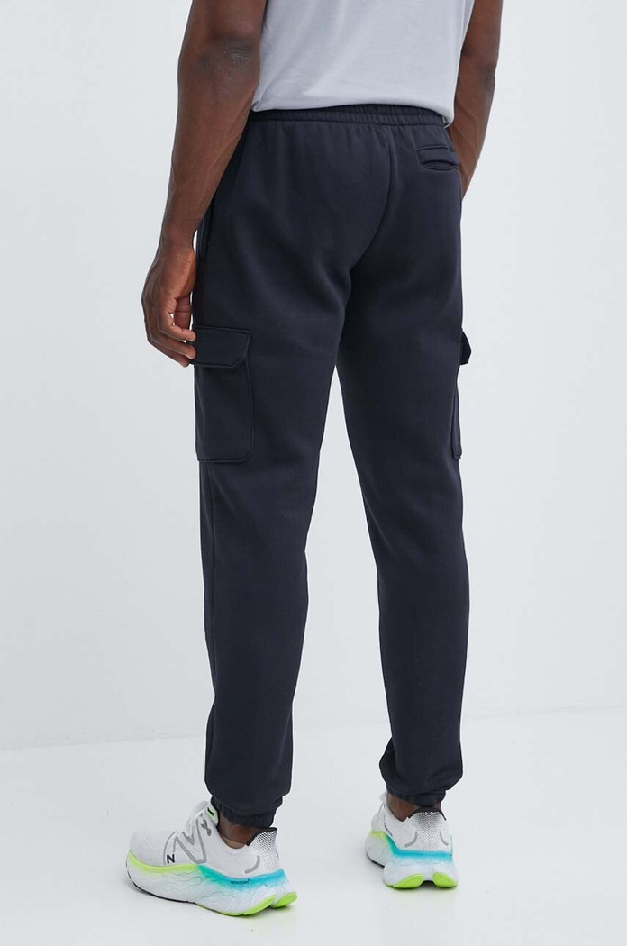 Odzież Under Armour spodnie dresowe Essential 1380376 czarny