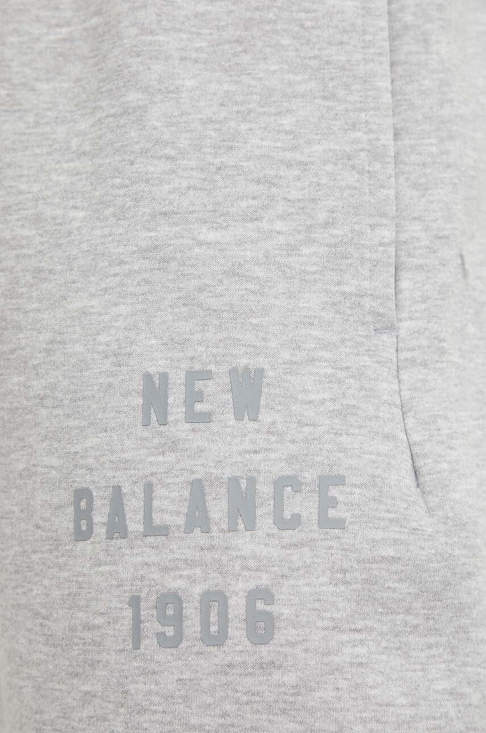 New Balance spodnie dresowe MP41505AG szary MP41505AG