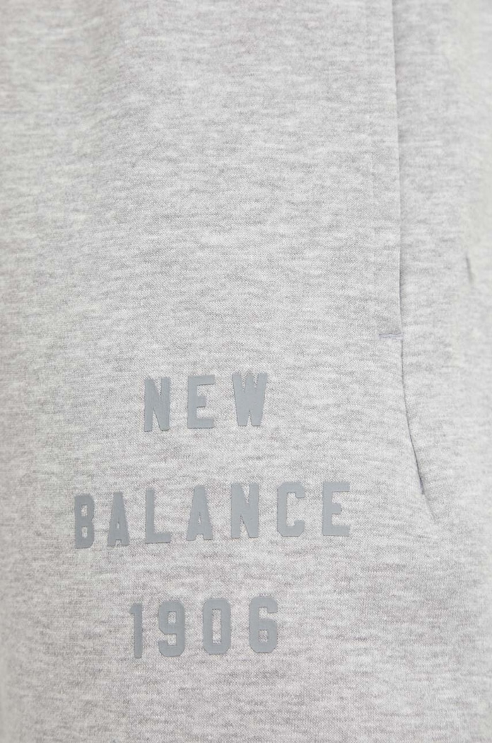 New Balance spodnie dresowe MP41505AG szary MP41505AG
