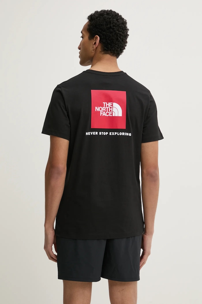 Ρούχα Βαμβακερό μπλουζάκι The North Face M S/S Redbox Tee NF0A87NPJK31 μαύρο