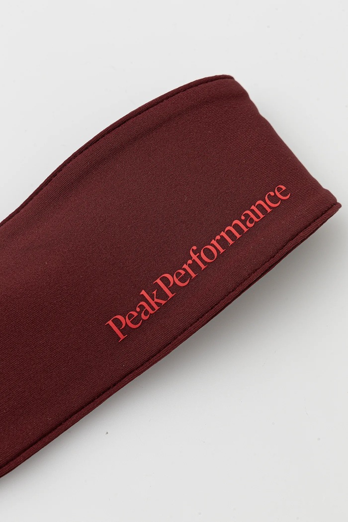 Čelenka Peak Performance G80370 burgundské SS25