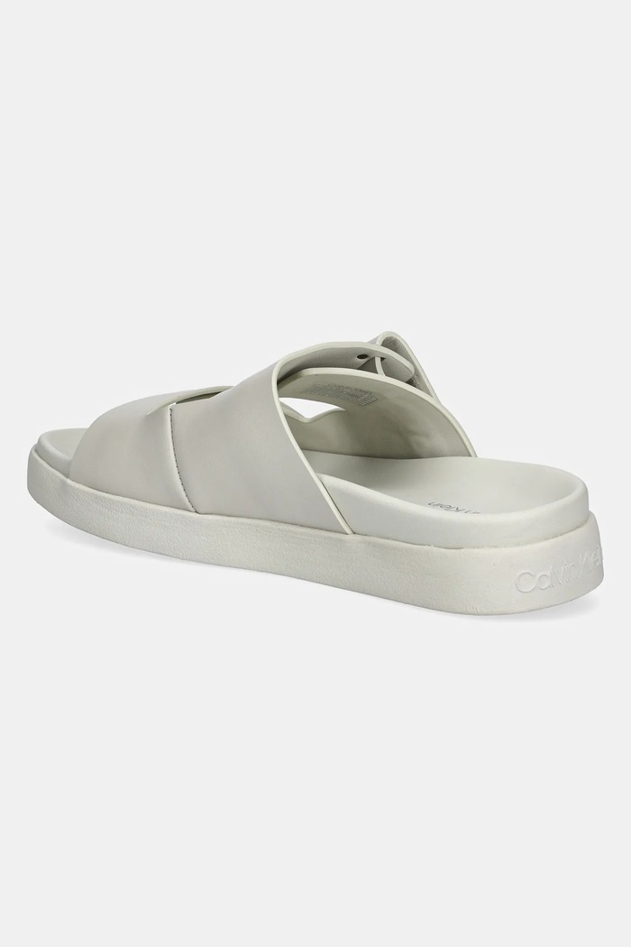 Kožené šľapky Calvin Klein FLAT ADJ SLIDE EYELET HW0HW02489 béžová SS25