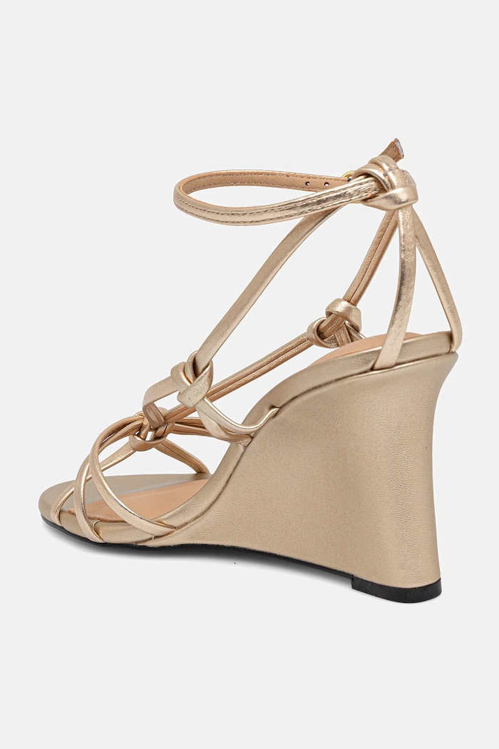 Obuwie Tommy Hilfiger sandały skórzane METAL LEATHER KNOTS WEDGE SANDAL FW0FW08801 złoty