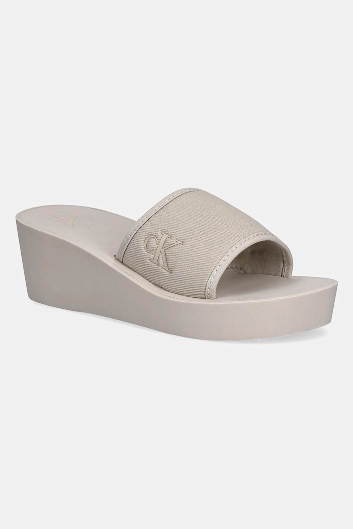 Calvin Klein Jeans klapki BEACH WEDGE SLIDE CANVAS 5-8 cm beżowy YW0YW01725