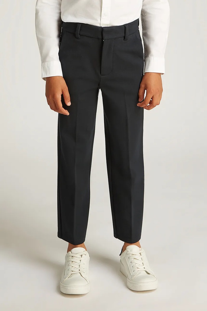 Detské nohavice Calvin Klein Jeans TAILORED PUNTO s elastanom čierna IB0IB02341.PPYA