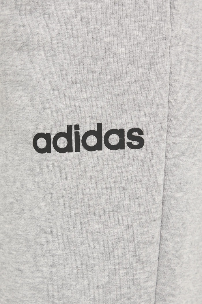 Odjeća Donji dio trenirke adidas Essentials Linear JC5953 siva