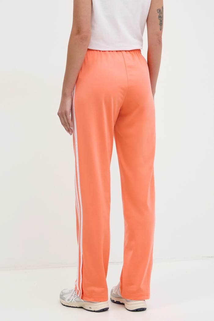Odzież adidas Originals spodnie dresowe Firebird JC8286 pomarańczowy