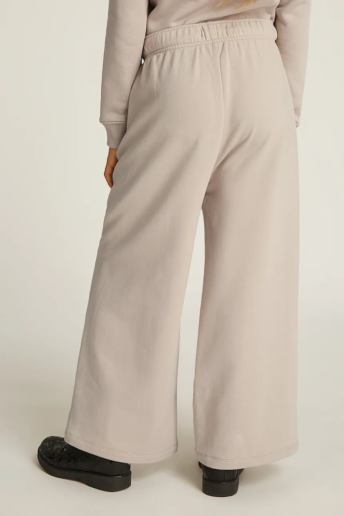 Calvin Klein Jeans spodnie dresowe dziecięce HANDW LOGO WIDE beżowy IG0IG02775.128.176.PPYA