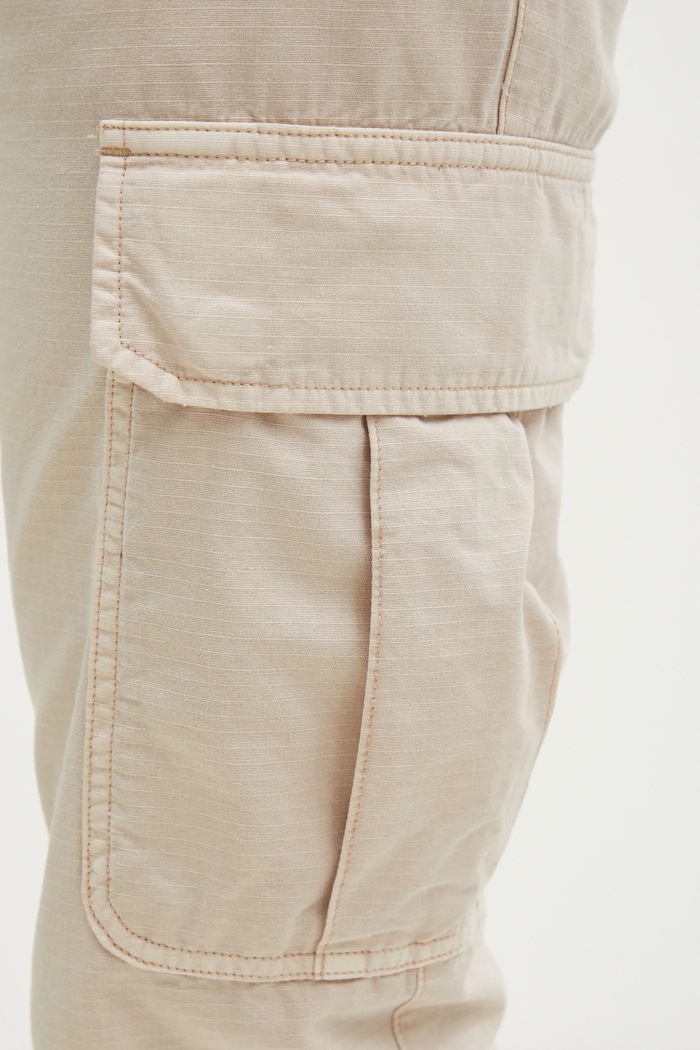 Bavlnené nohavice Tommy Jeans béžová DM0DM20284