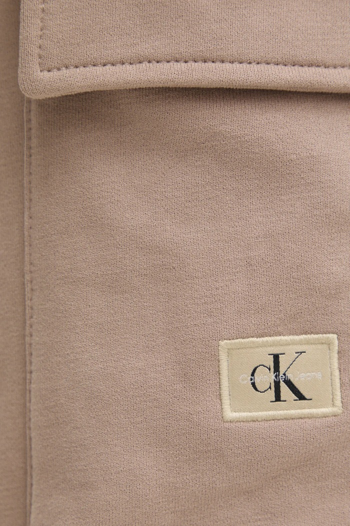 Bavlněné tepláky Calvin Klein Jeans J30J326762 béžová