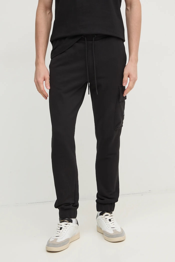 Bavlněné tepláky Calvin Klein Jeans pletenina černá J30J326762
