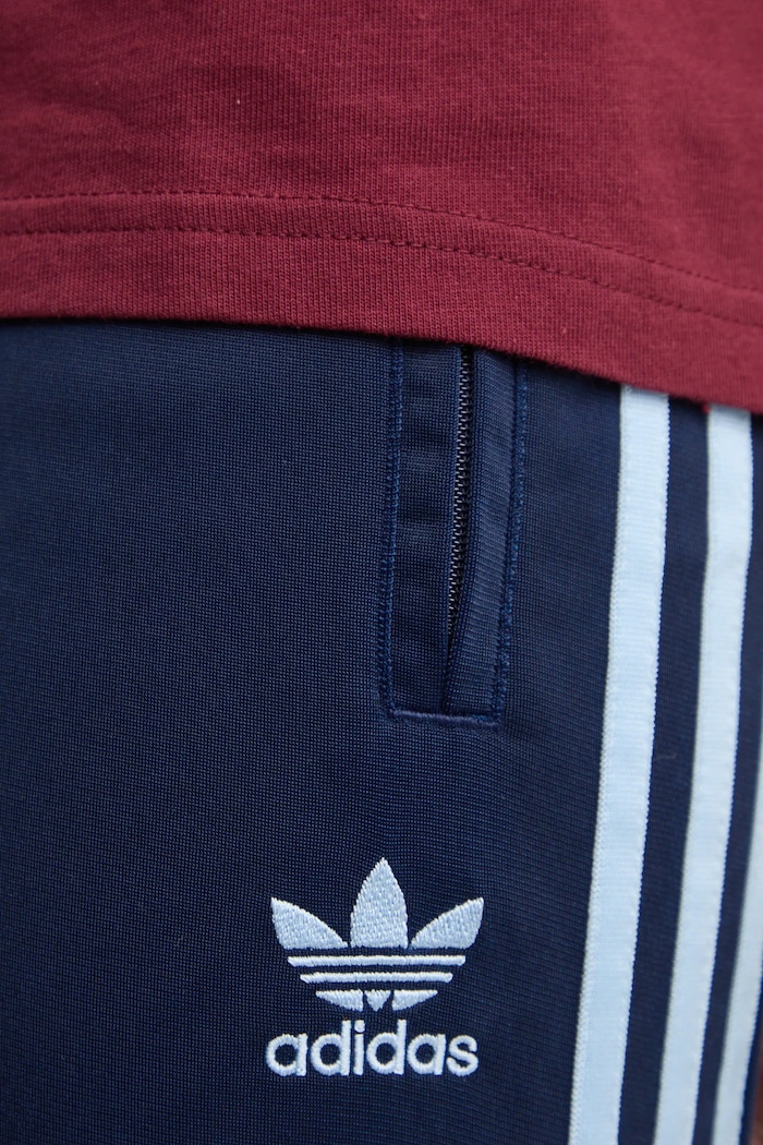 Tepláky adidas Originals Firebird tmavomodrá JP2540