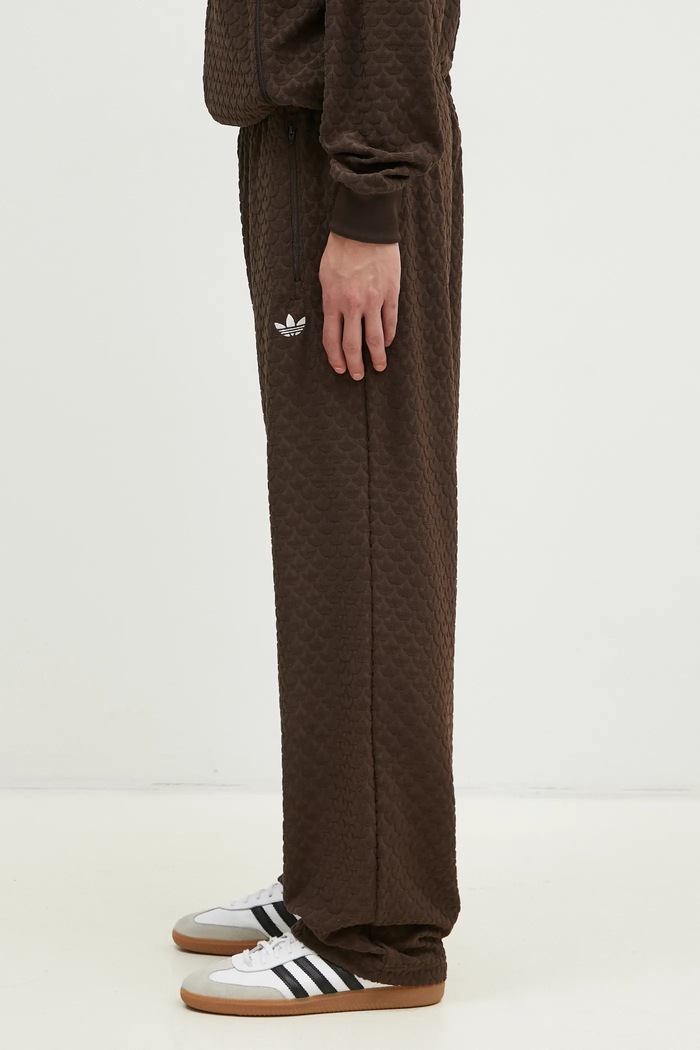 Tepláky adidas Originals Q12 MONOGRAM TR JP4428 hnědá SS25
