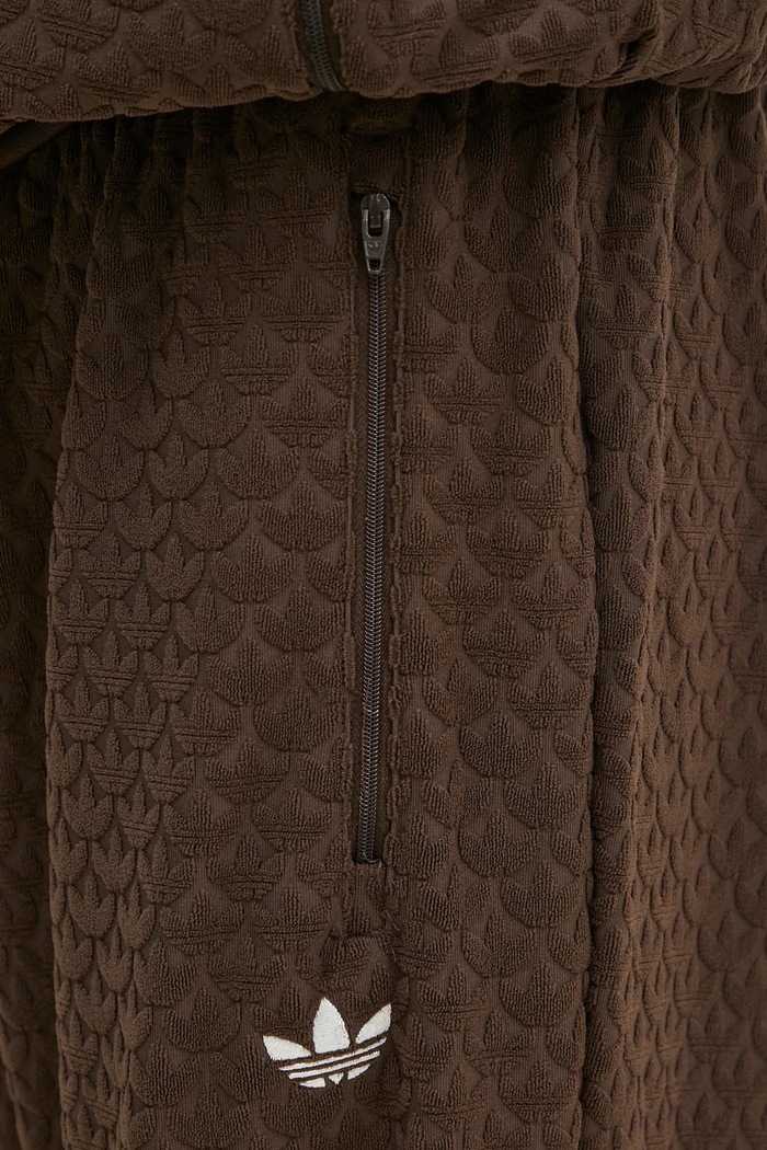 Tepláky adidas Originals Q12 MONOGRAM TR hnědá JP4428