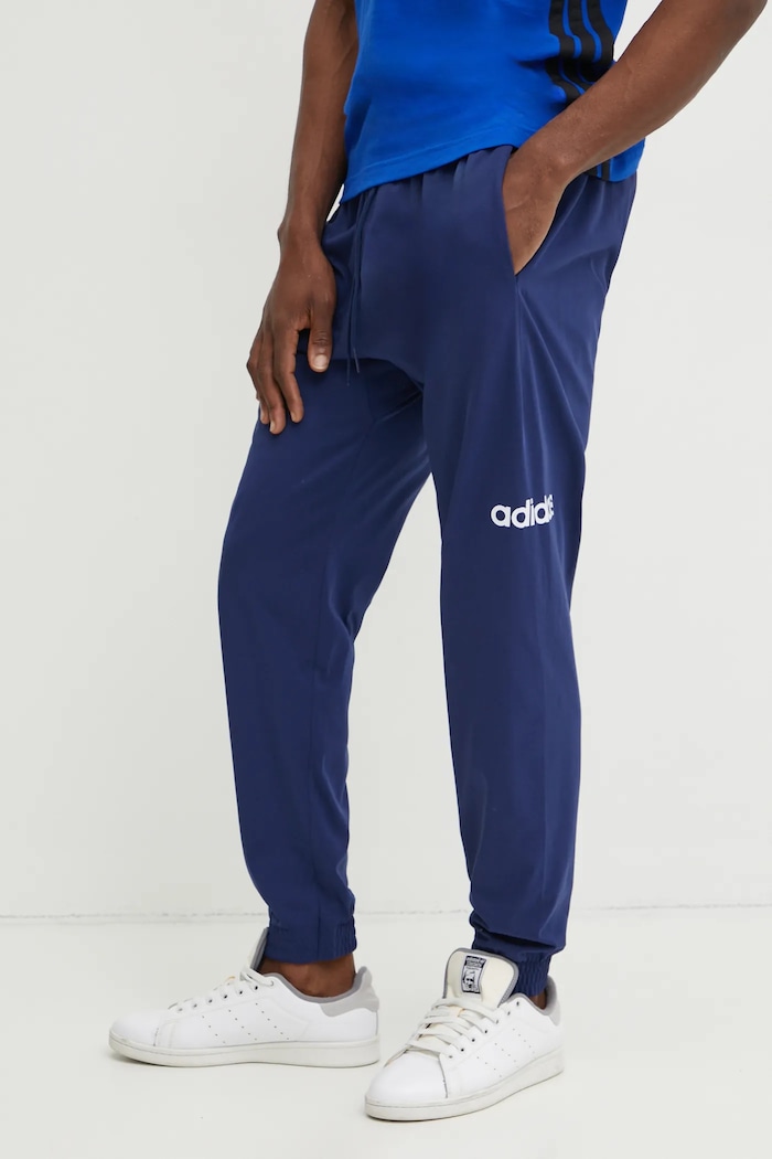 Tepláky adidas Essentials Linear tmavomodrá JE9011