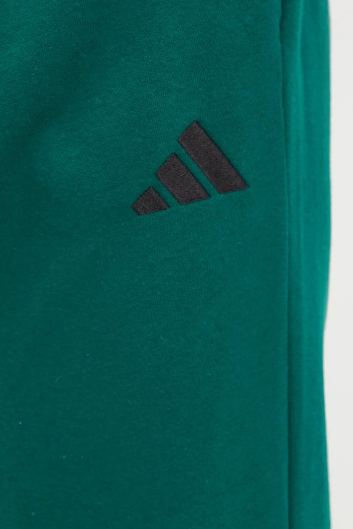Tepláky adidas Feelcozy zelená IN6072