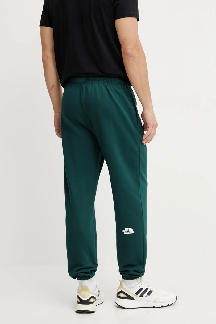 Odzież The North Face Spodnie dresowe Simple Dome NF0A8C1W6GI1 zielony