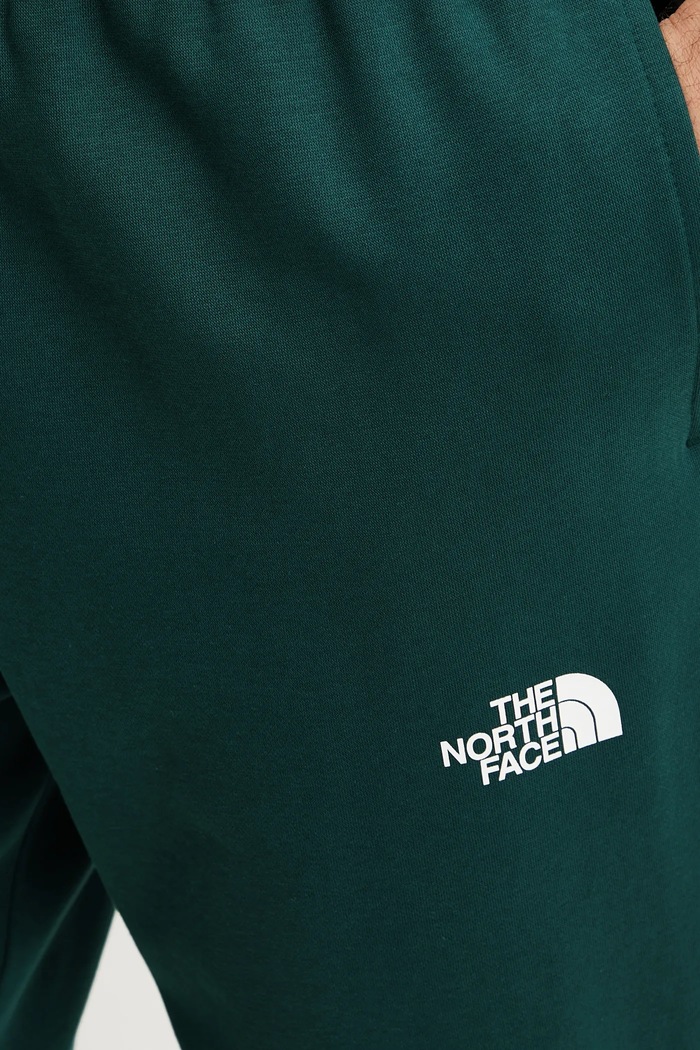 Spodnie dresowe Simple Dome The North Face NF0A8C1W6GI1 zielony