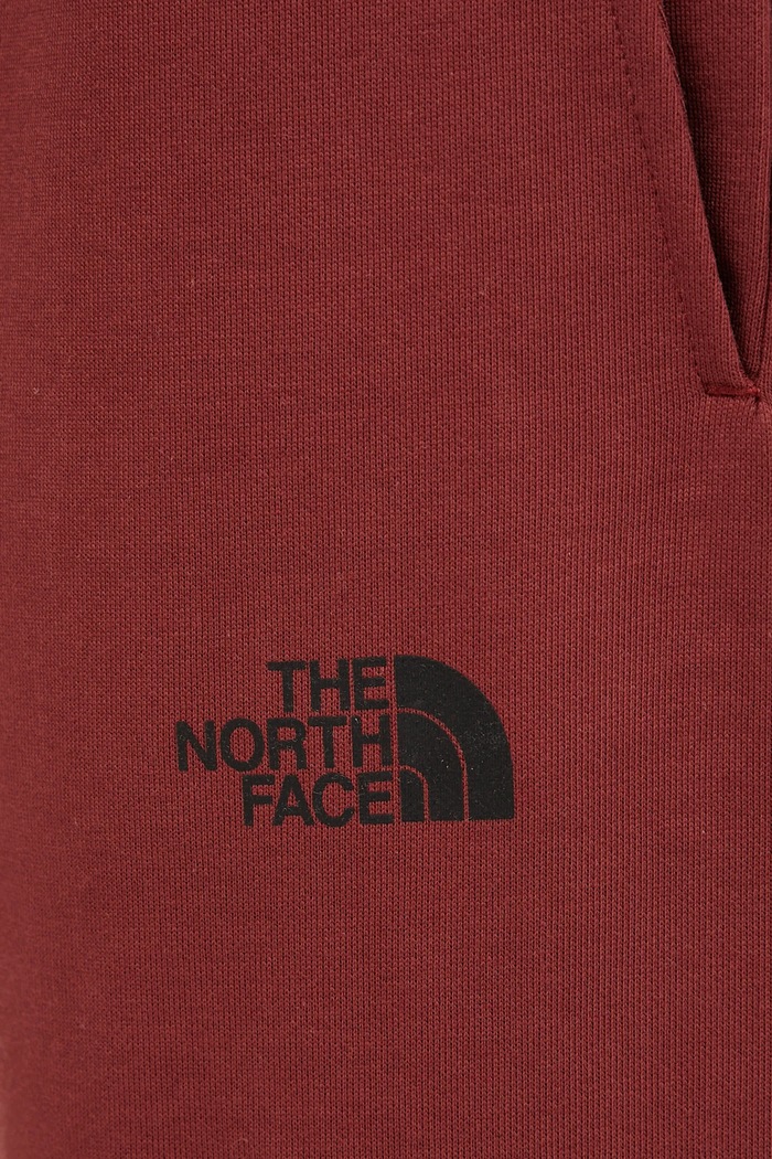 Tepláky The North Face TNF X NSE červená NF0A8C3W0VO1