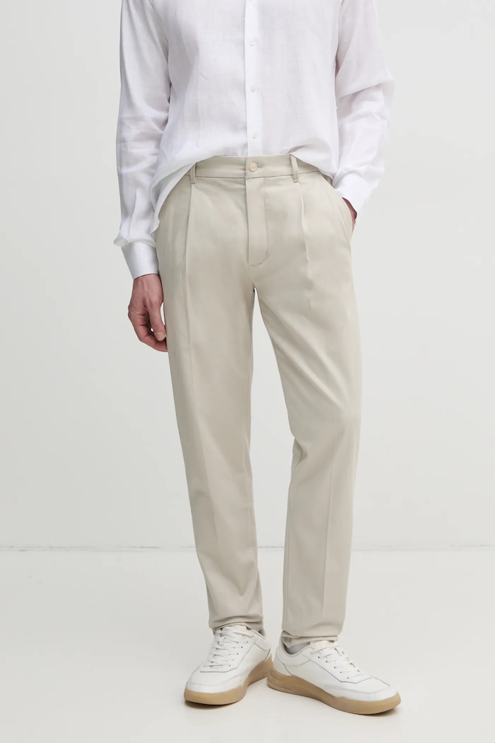 Calvin Klein spodnie z elastanem beżowy K10K114104