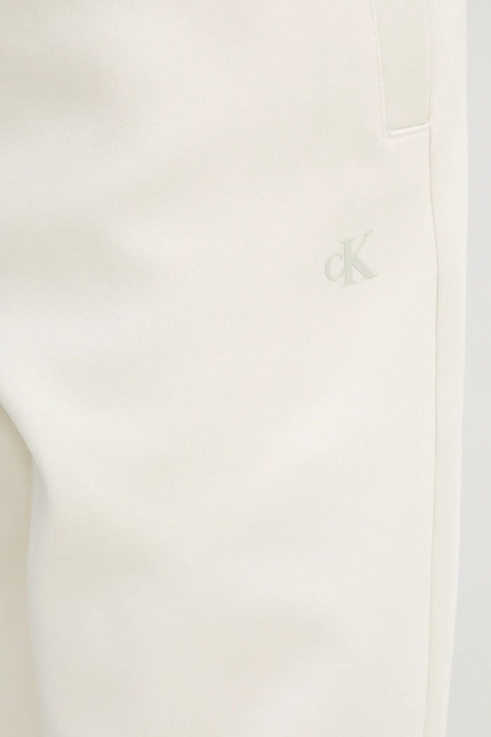 Tepláky Calvin Klein Jeans béžová J30J327241