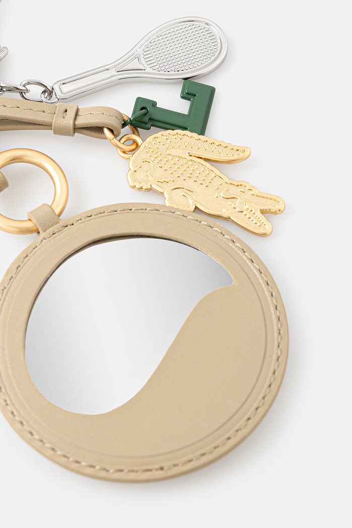 Lacoste klíčenka dámská bez kamene NF5229RL béžová SS26