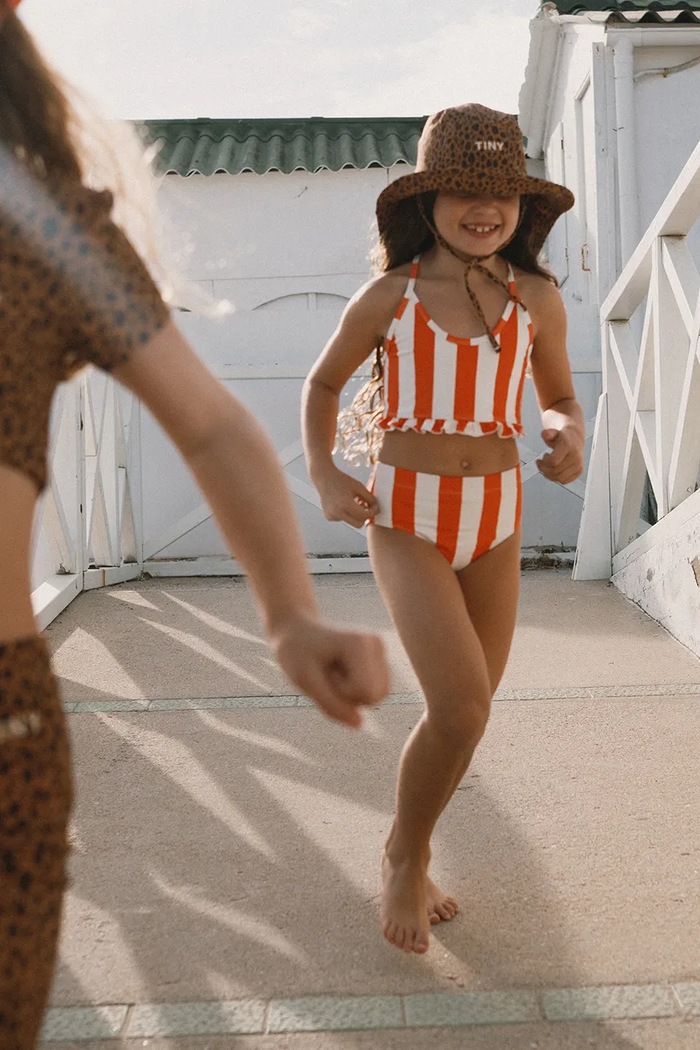 Dvoudílné dětské plavky Tinycottons RED STRIPES SWIM SET měkké oranžová SS26.439