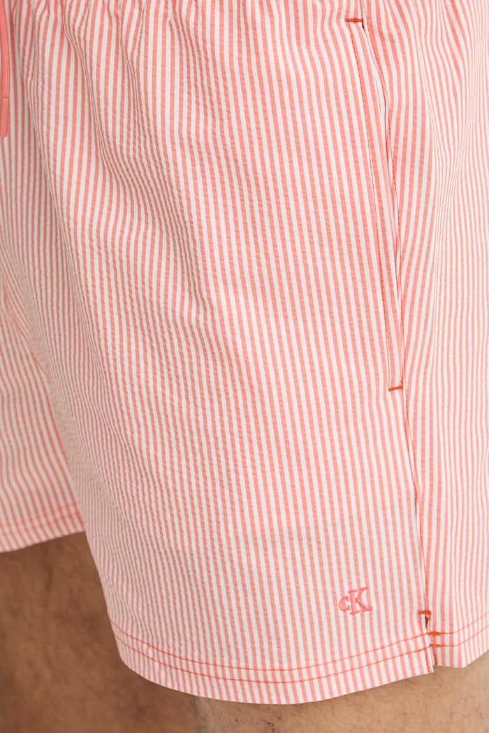 Calvin Klein plavecké šortky pánske oranžová LV00N61041
