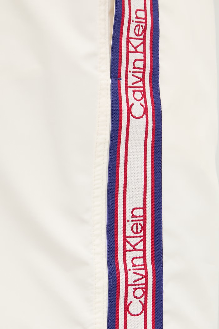Calvin Klein plavecké šortky pánske béžová LV00N61042